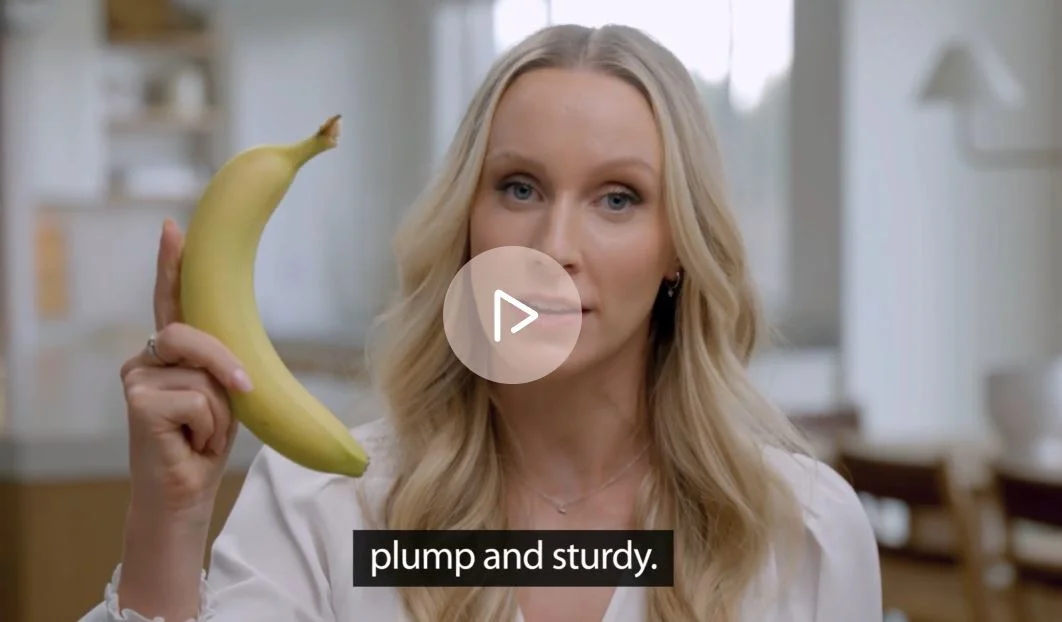 Dr. Miller holding a banana to demonstrate — full image visible for context
